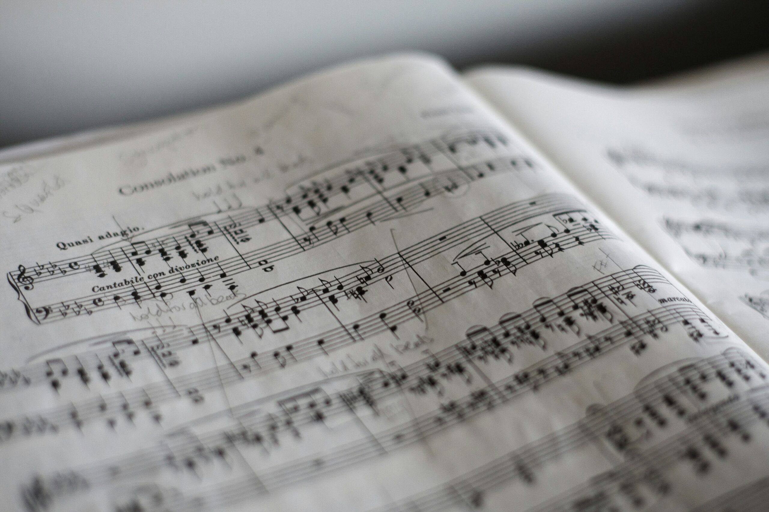 Stock photo of sheet music, overlaid with a green tone.